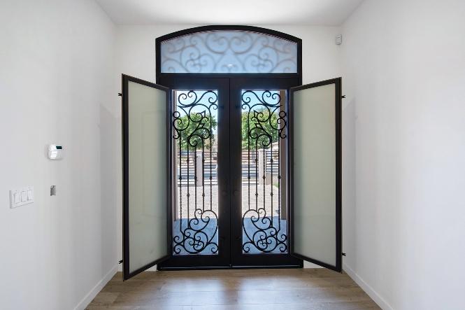 Damaged gate being repaired by restoration technician in Sherman Oaks, CA